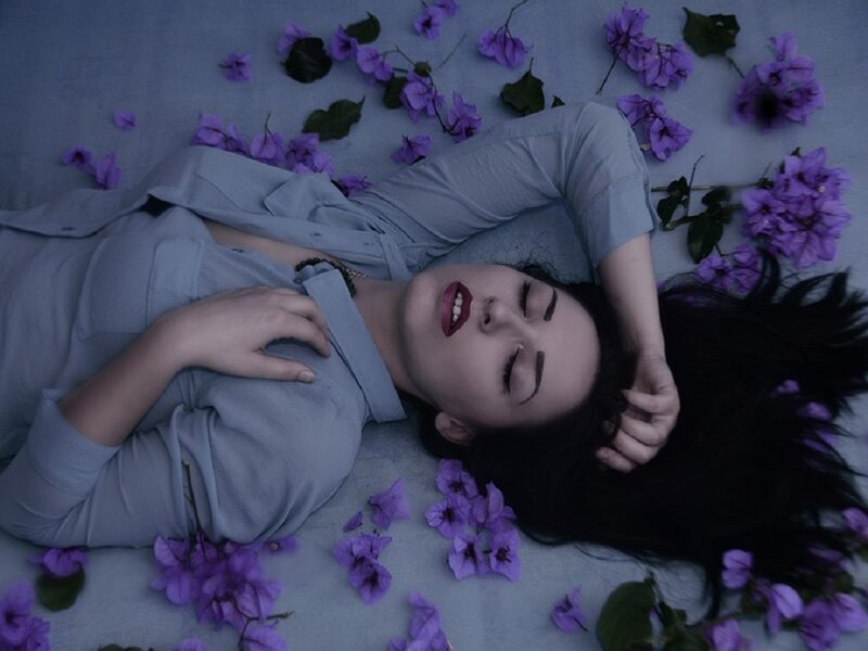 Woman Lying on Flowers — Purple