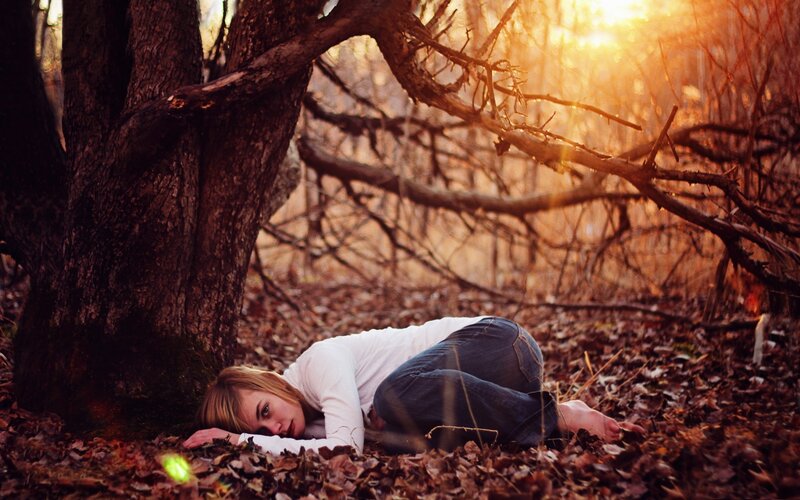 Woman Lying on Forest Floor — Brown, Dramatic, Sunset