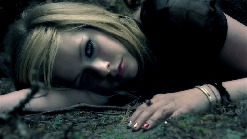 woman lying on forest floor