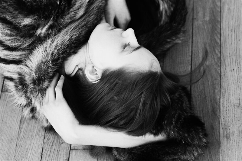 Woman Lying on Fur — Black, Calm