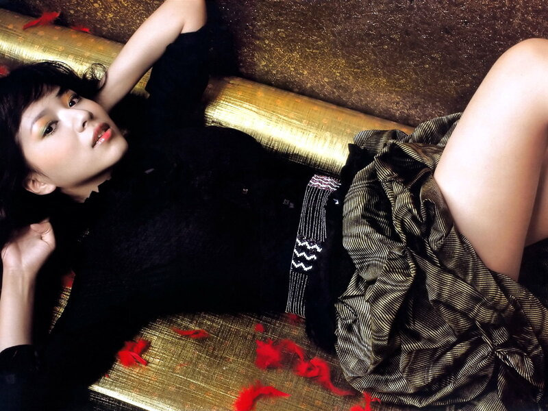 woman lying on golden couch