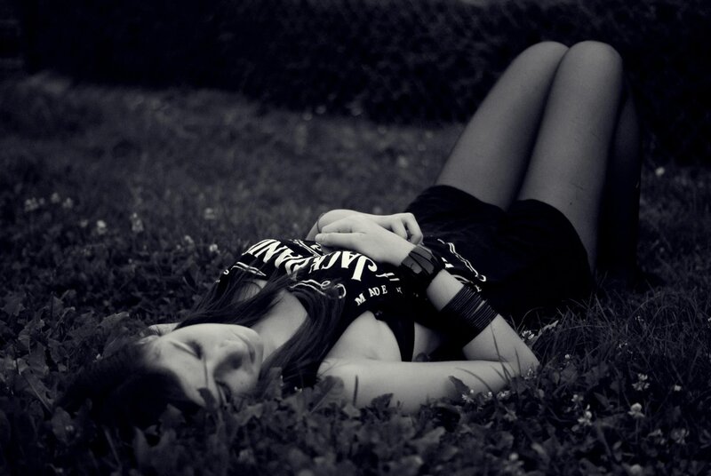 woman lying on grass