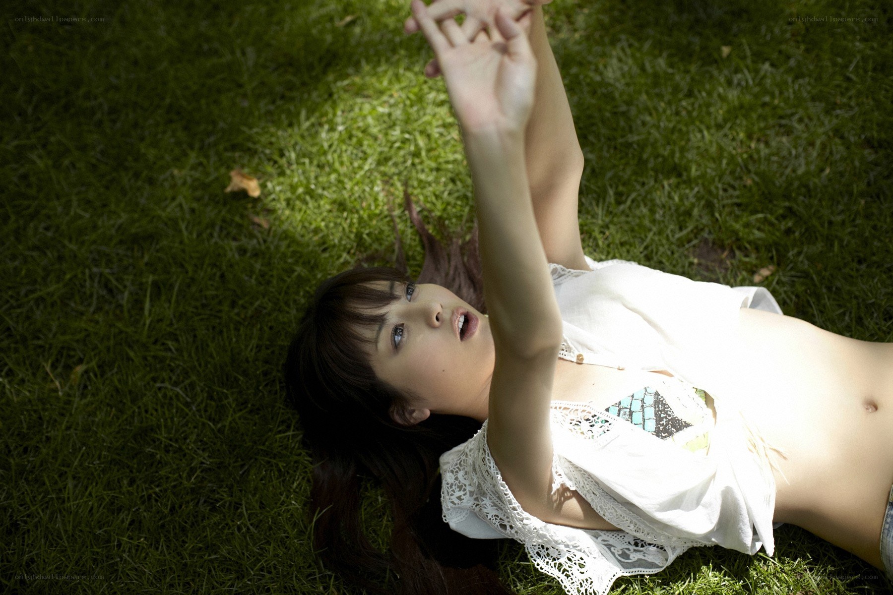 woman lying on grass