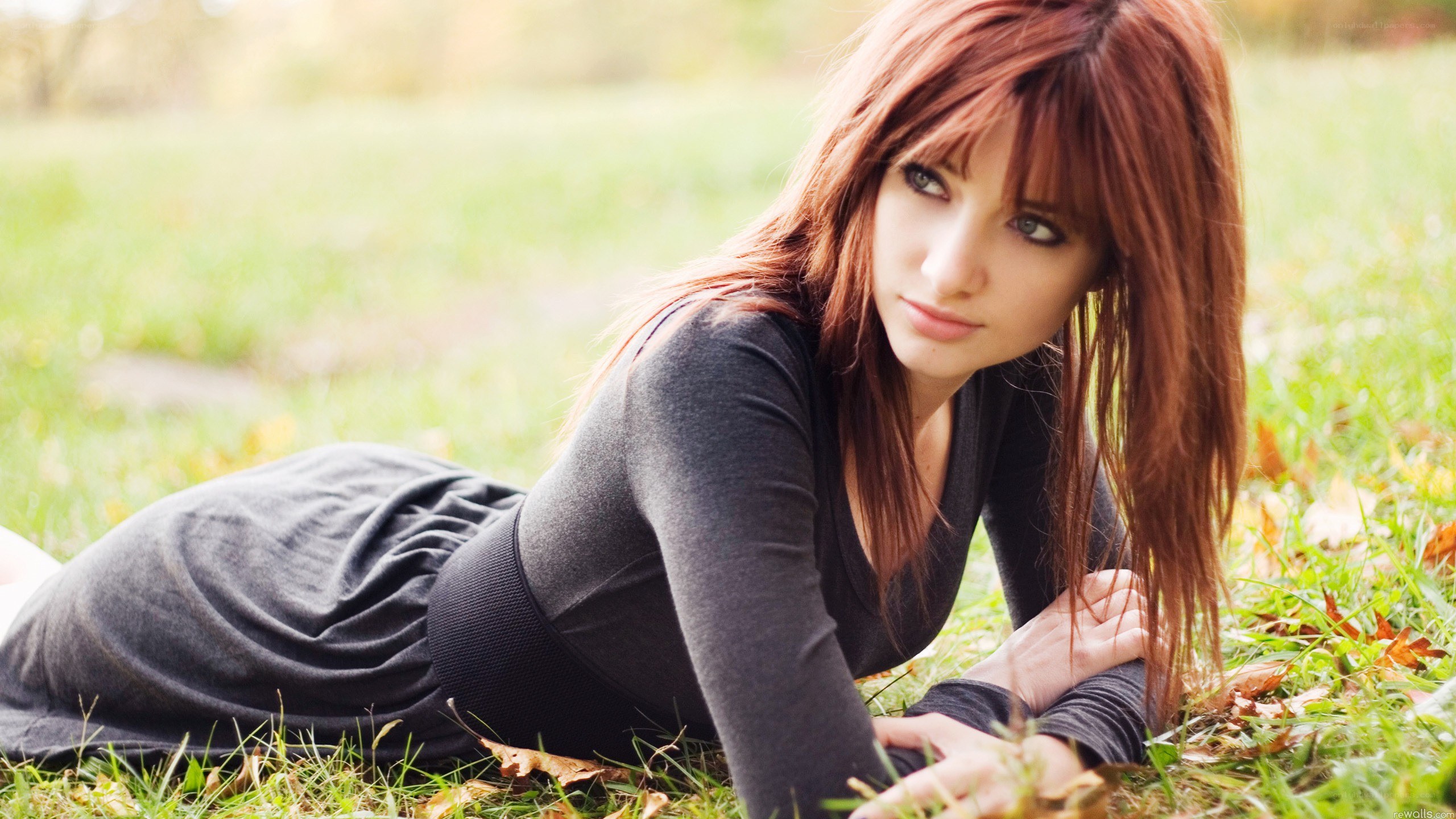 woman lying on grass