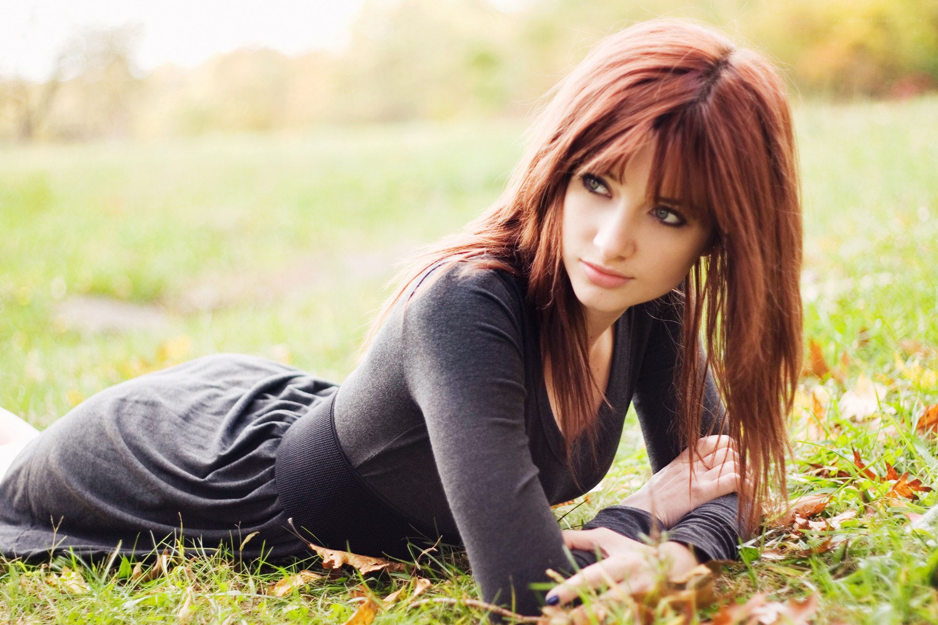 woman lying on grass