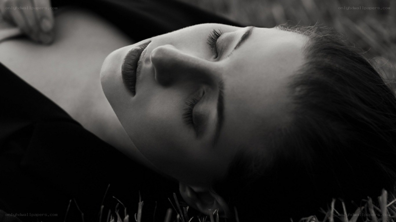woman lying on grass
