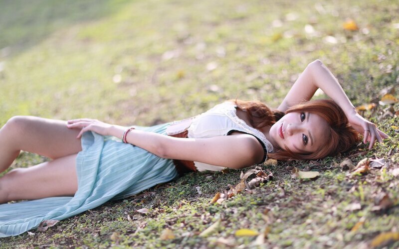 woman lying on grass