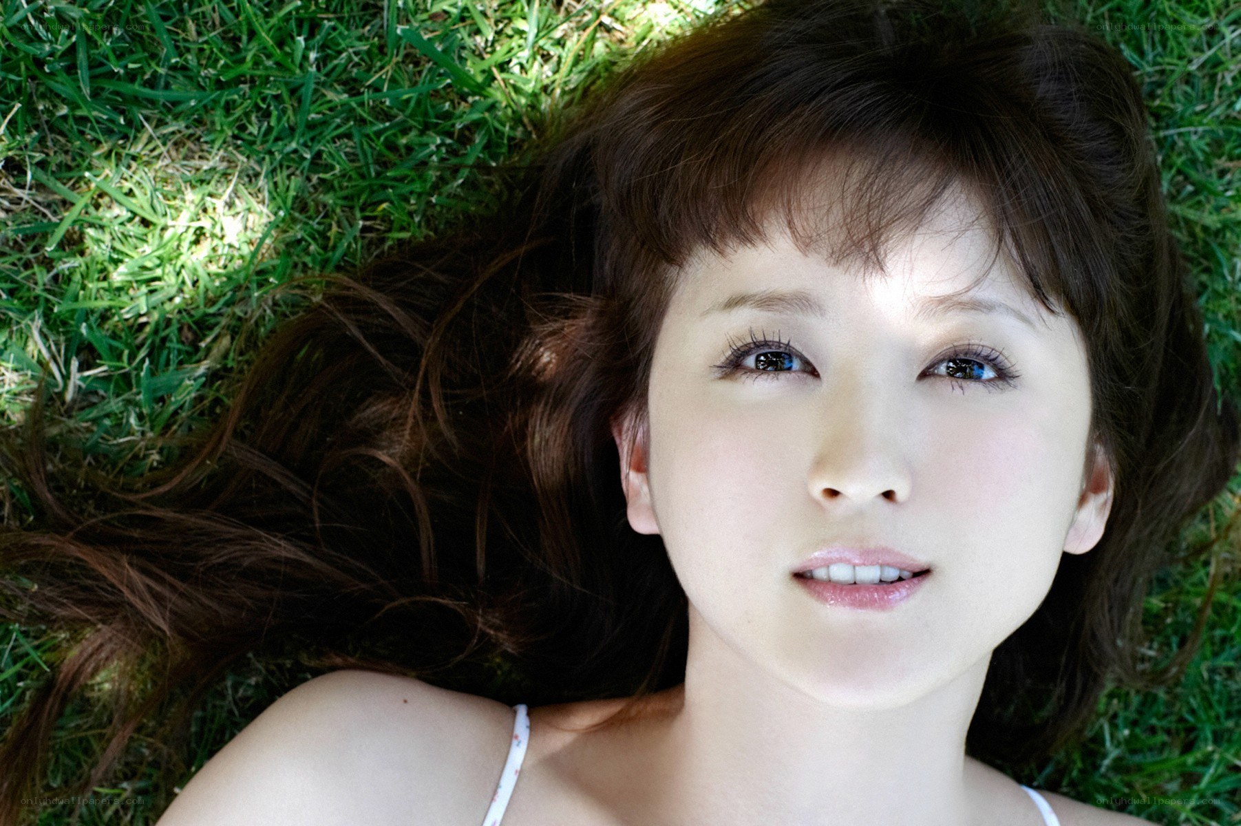 woman lying on grass