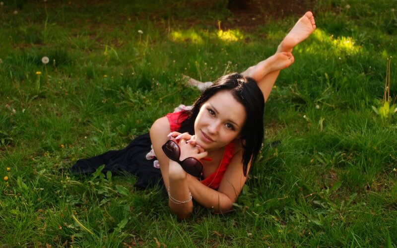 woman lying on grass
