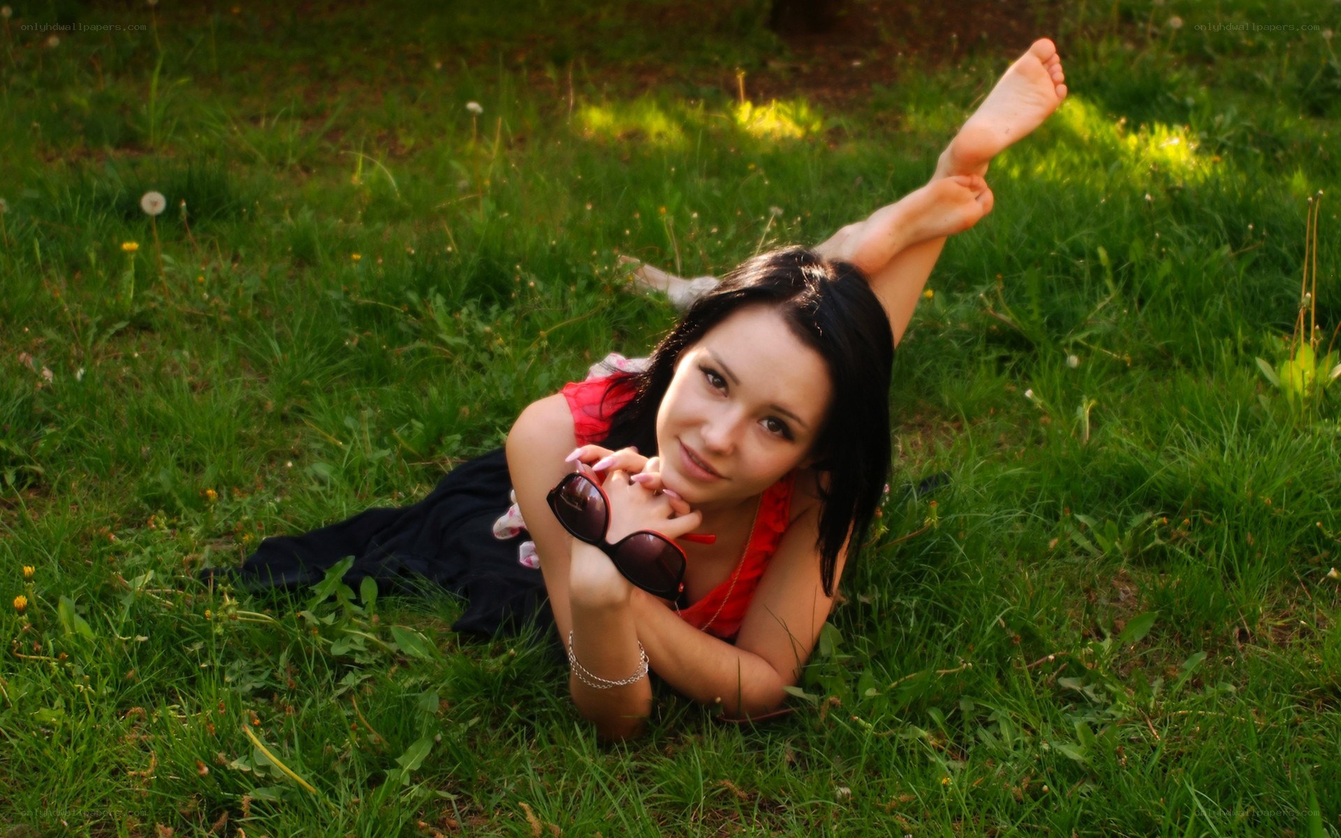 woman lying on grass