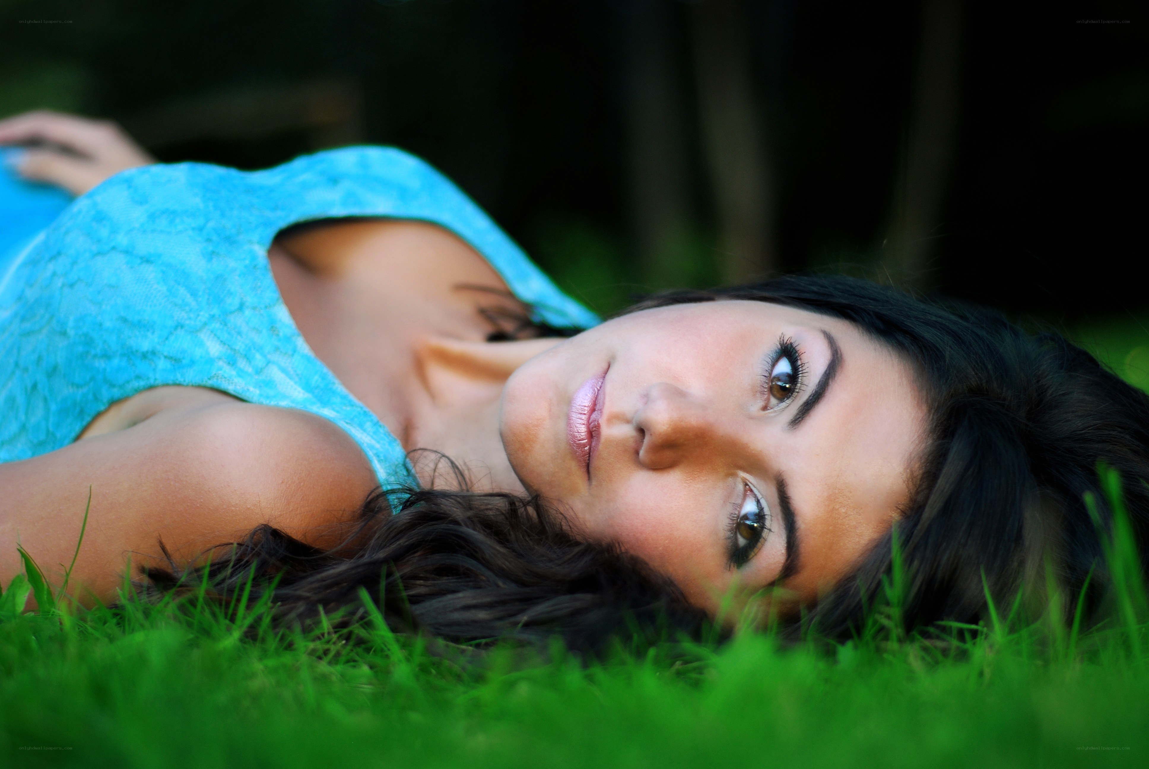 woman lying on grass