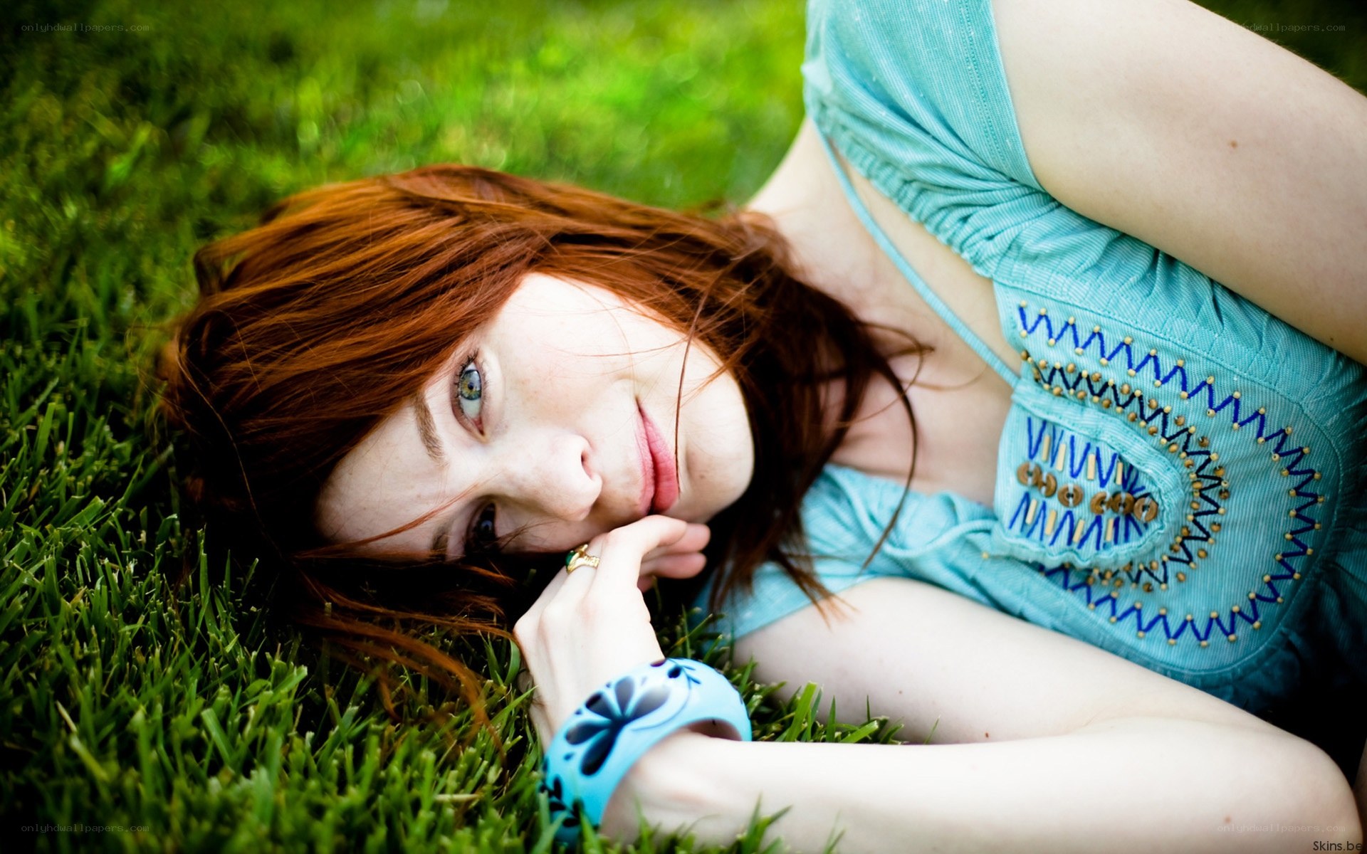 Woman lying on grass