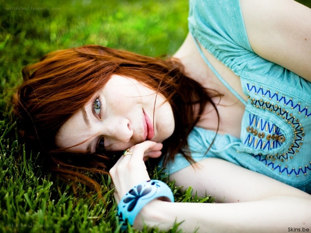 woman lying on grass