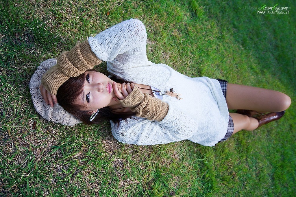 woman lying on grass