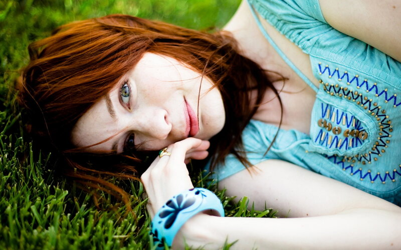 woman lying on grass