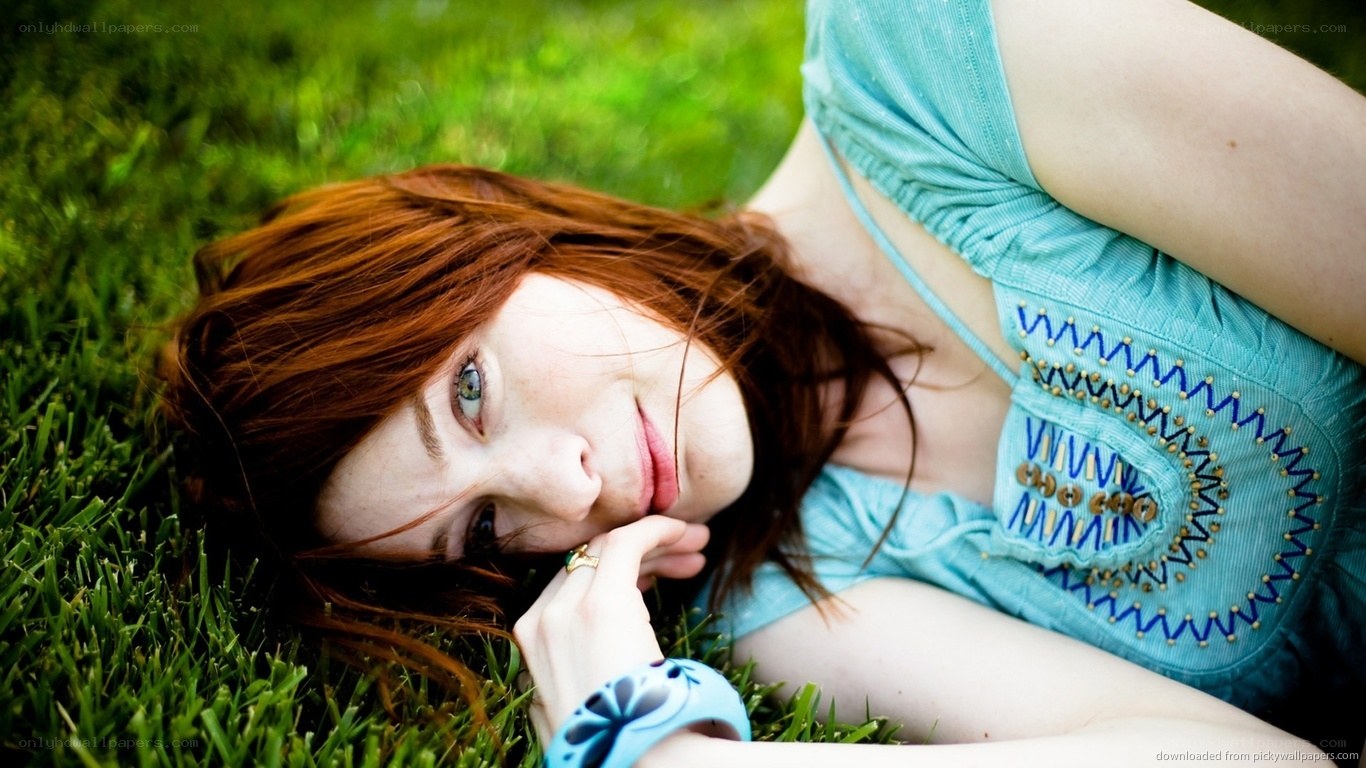 woman lying on grass