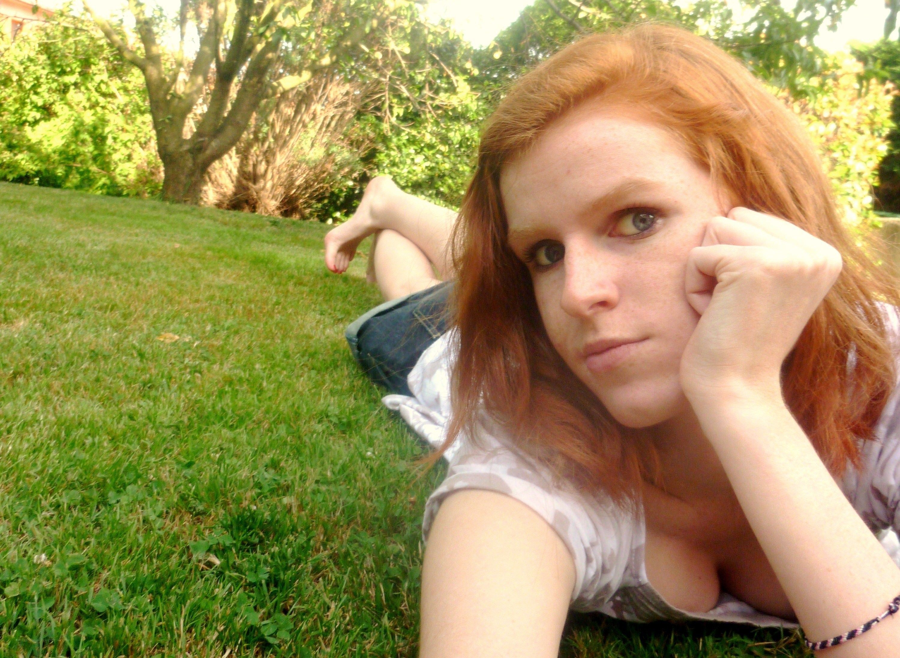 woman lying on grass
