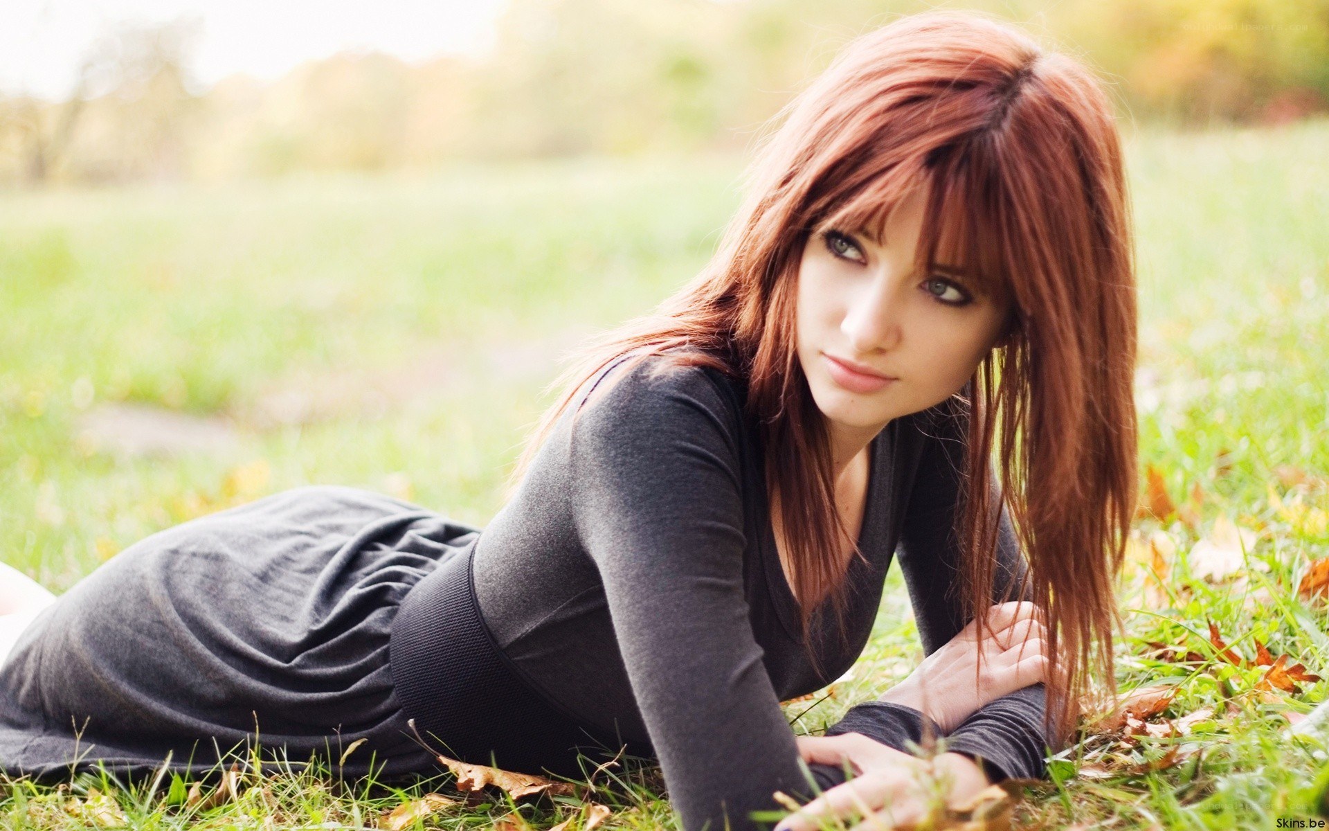 woman lying on grass