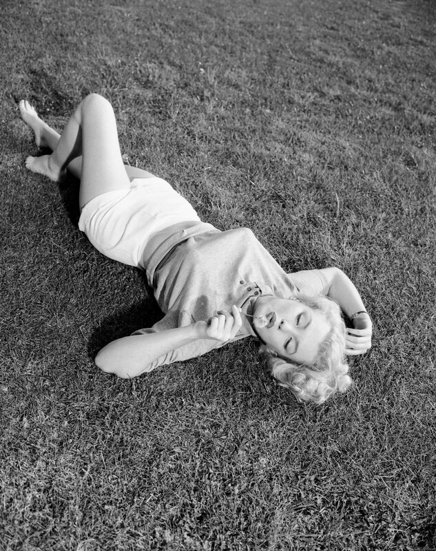 woman lying on grass