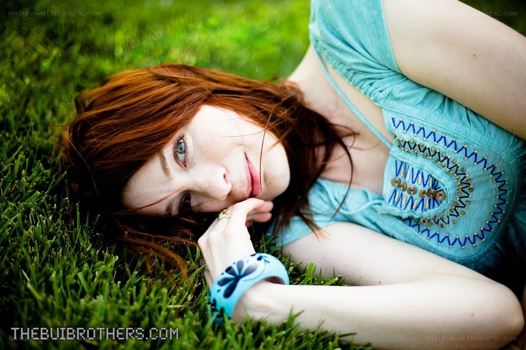 woman lying on grass