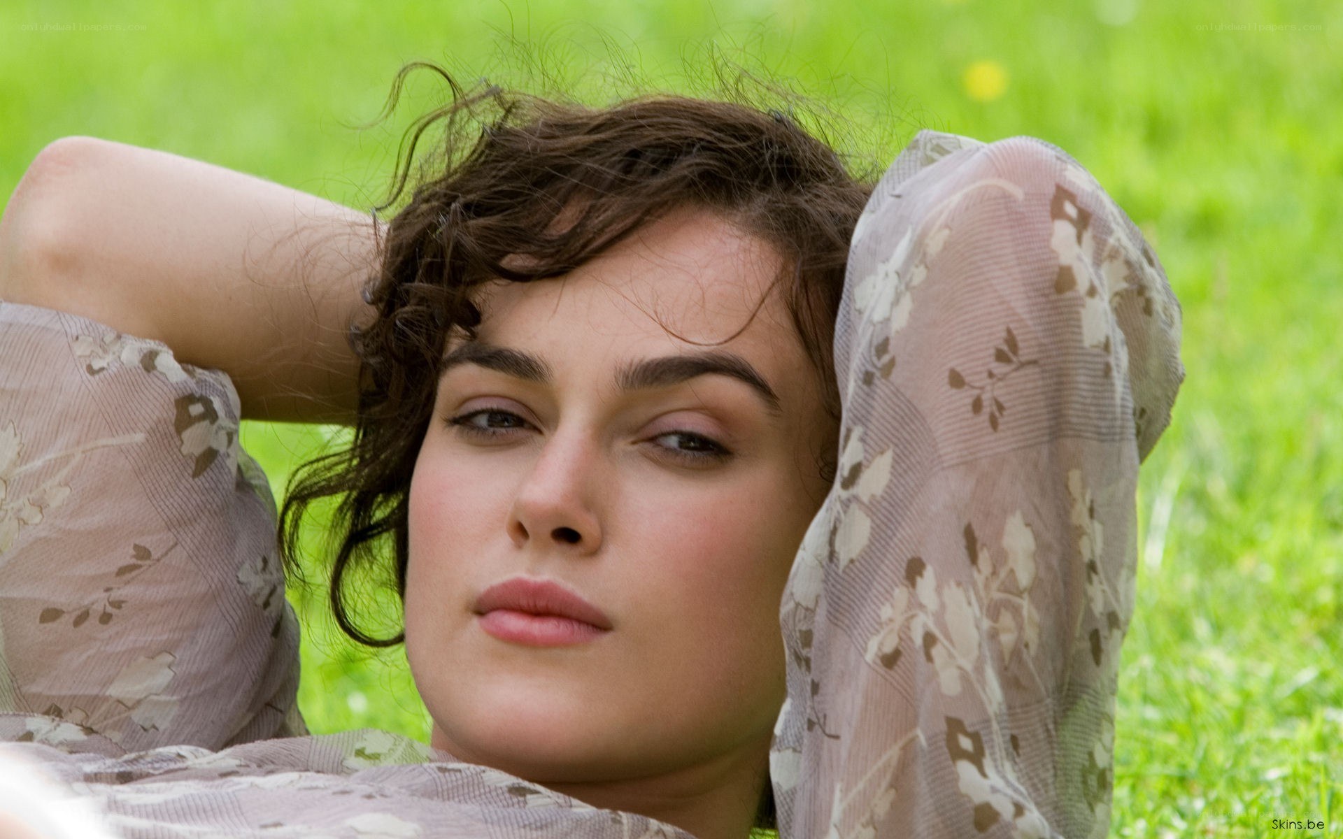 woman lying on grass