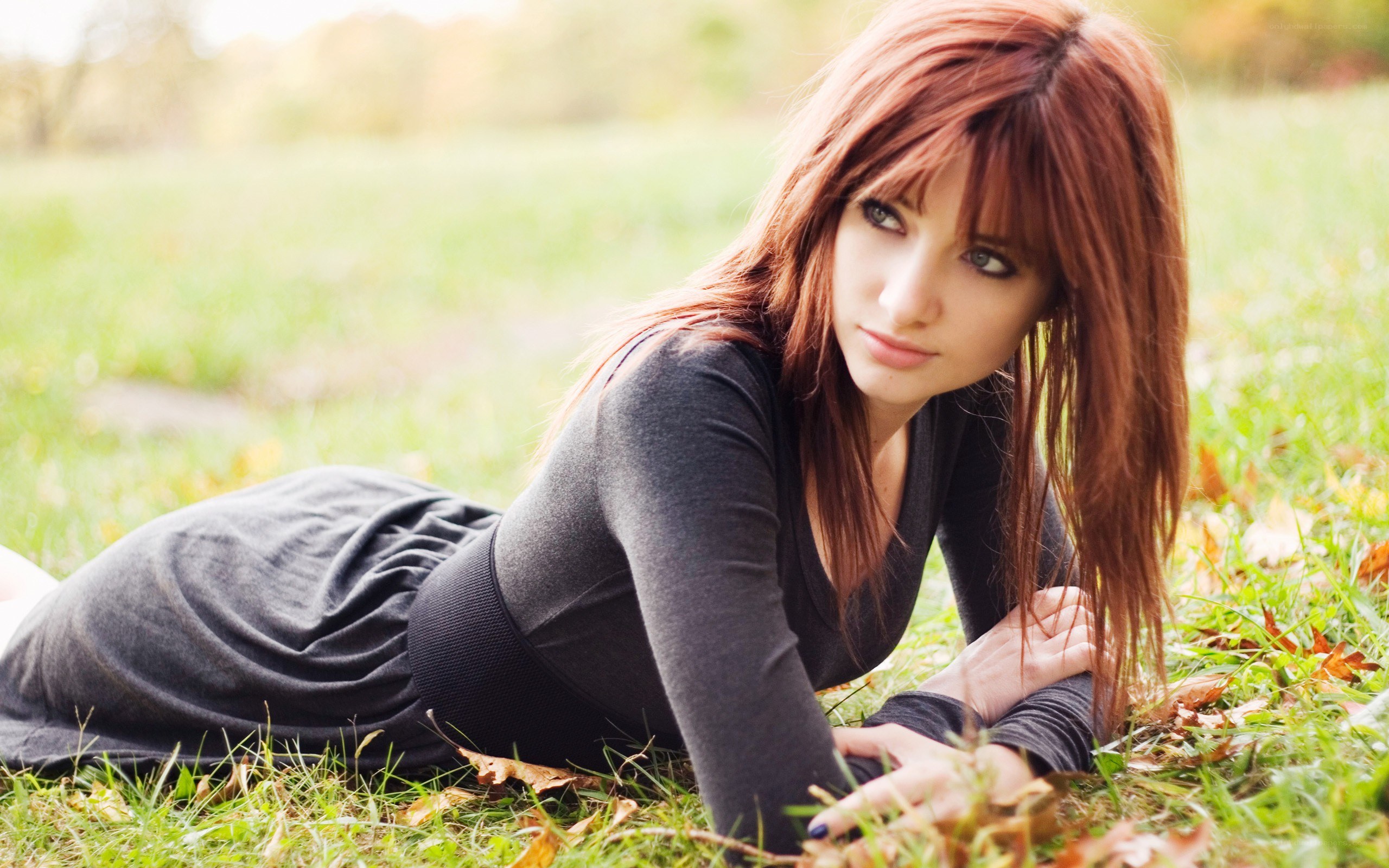 woman lying on grass