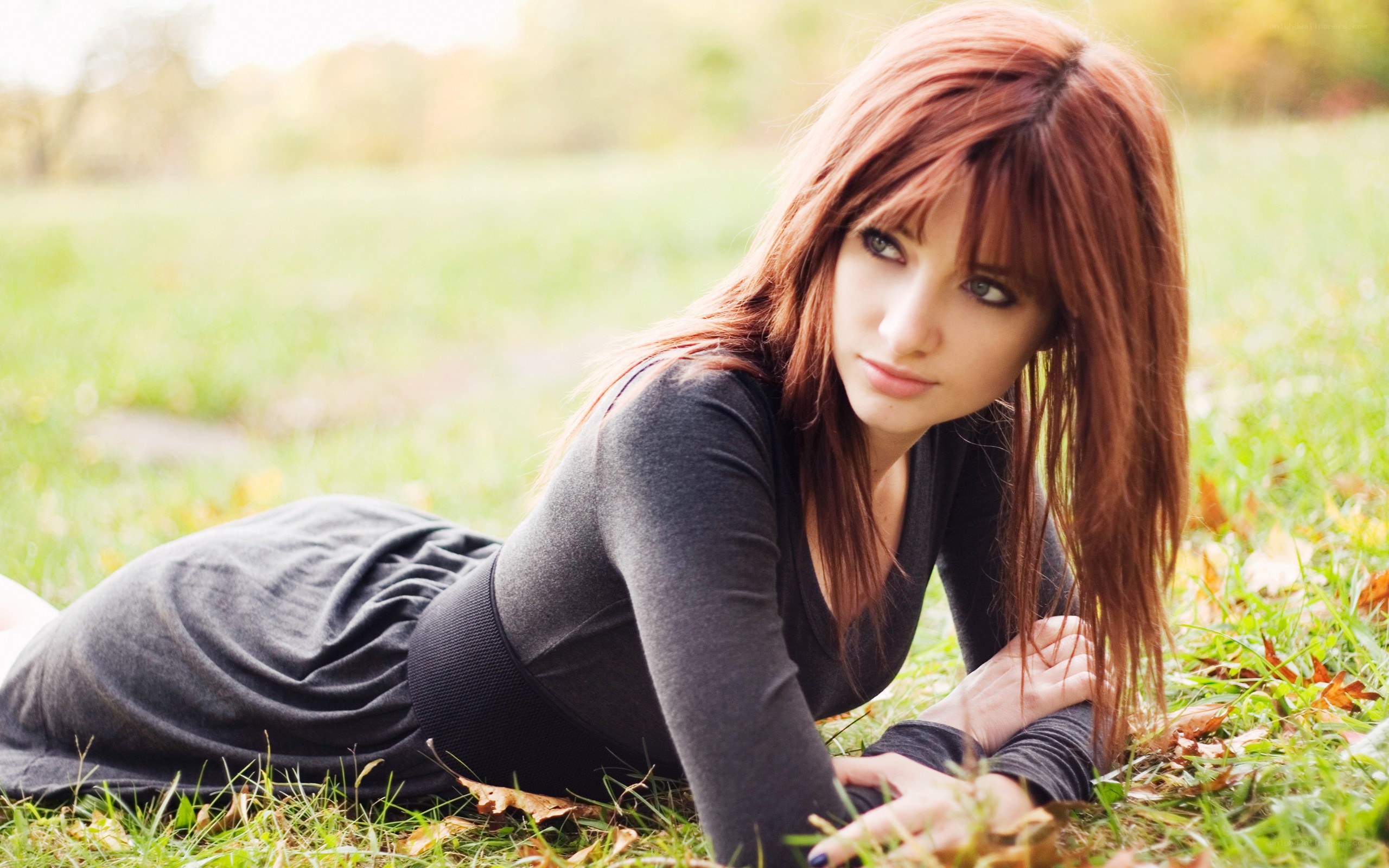 woman lying on grass