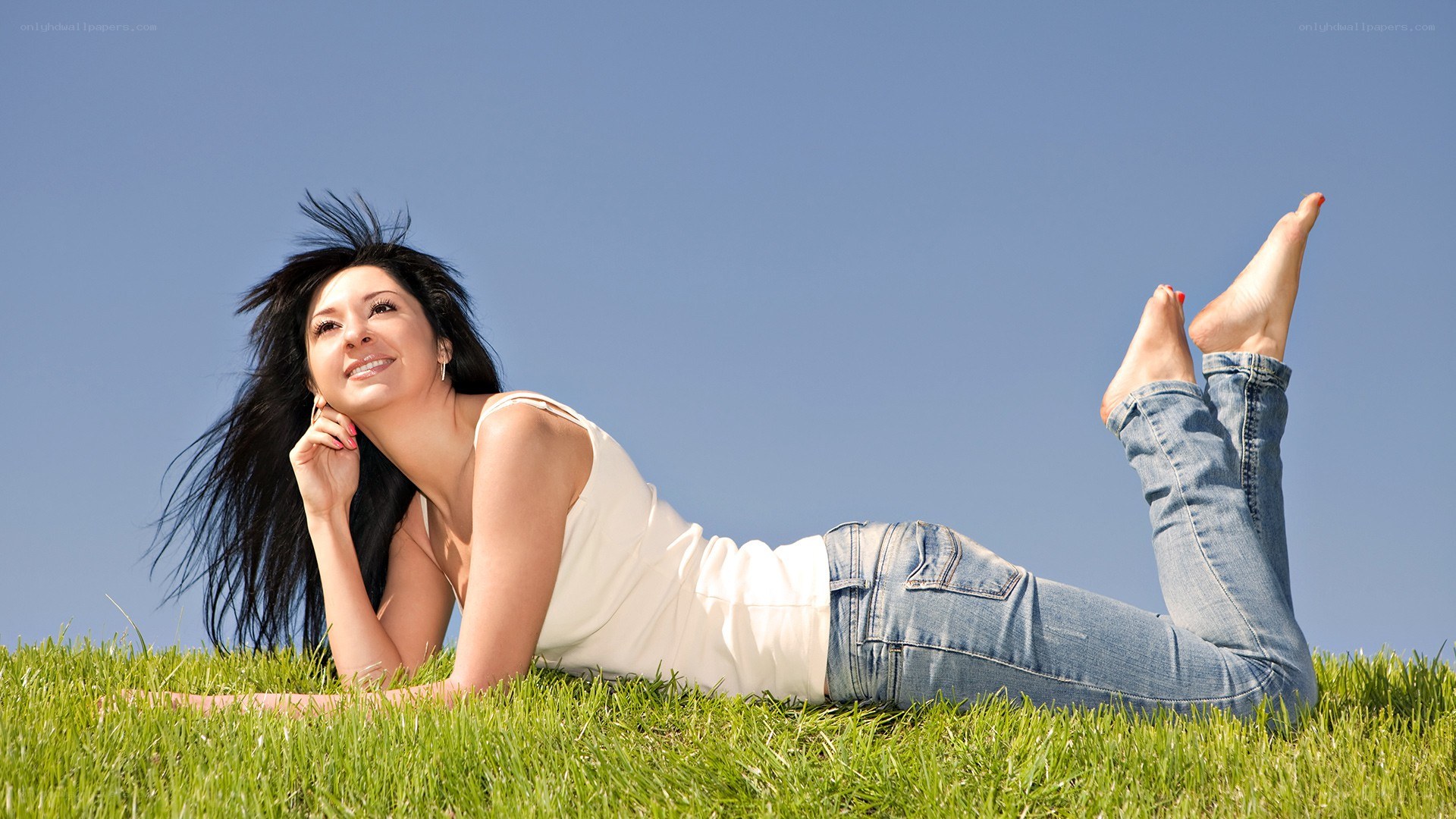 woman lying on grass
