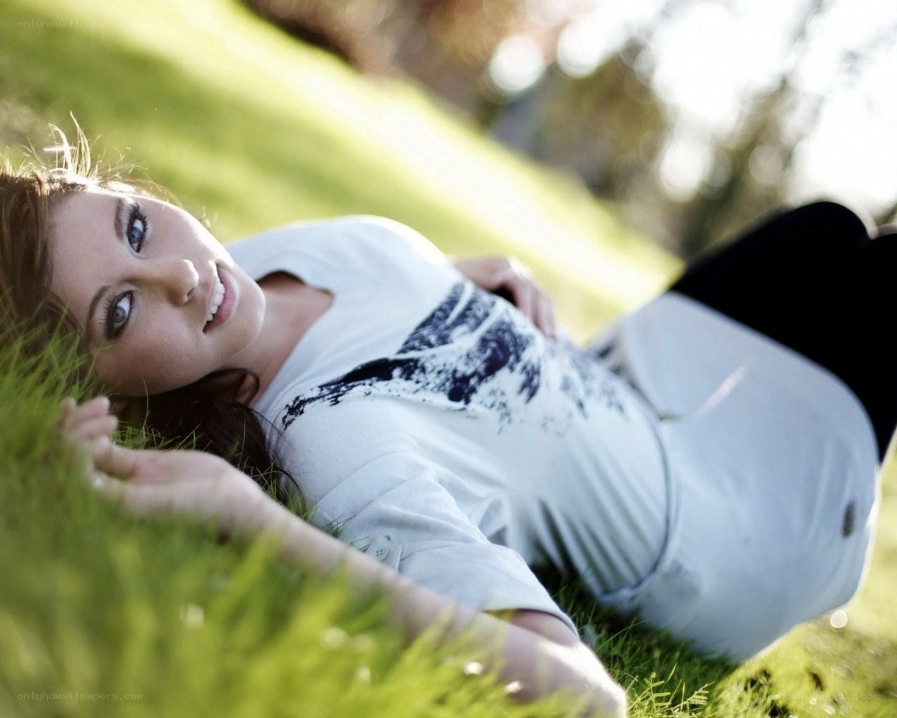 woman lying on grass
