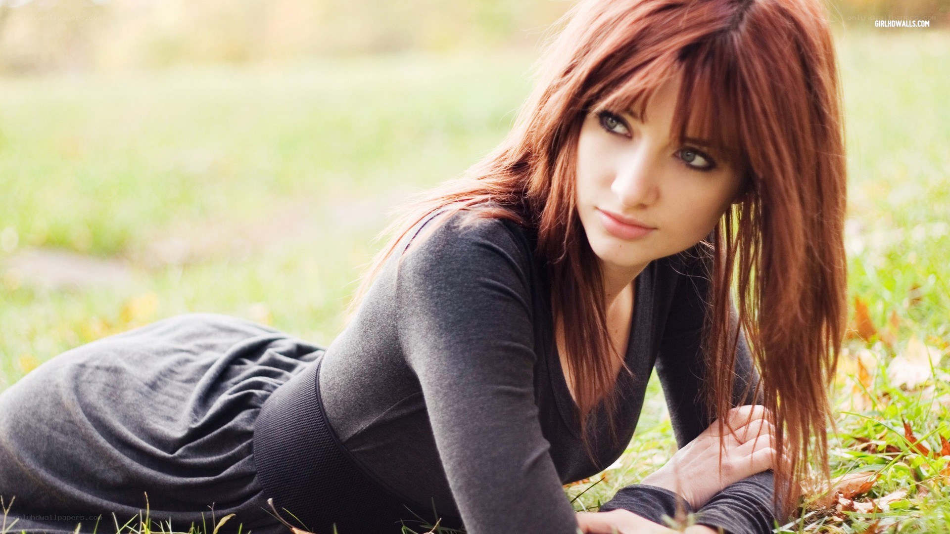 woman lying on grass