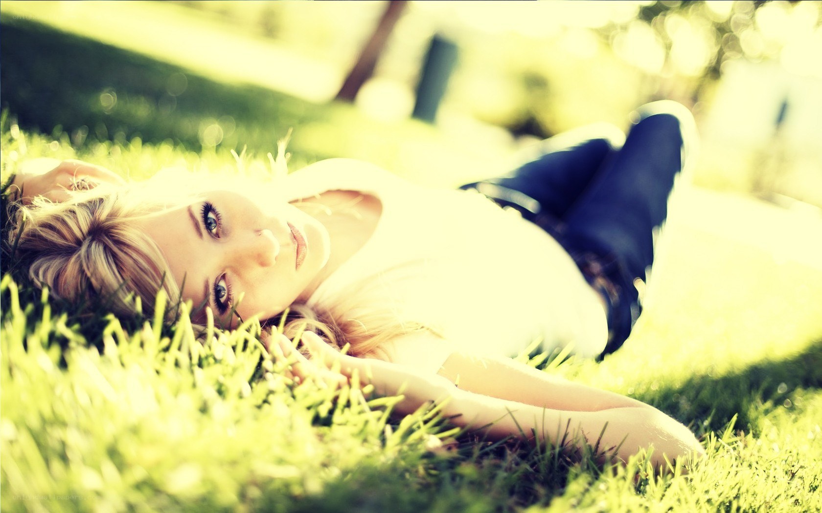 woman lying on grass