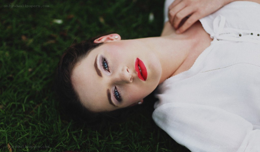 woman lying on grass