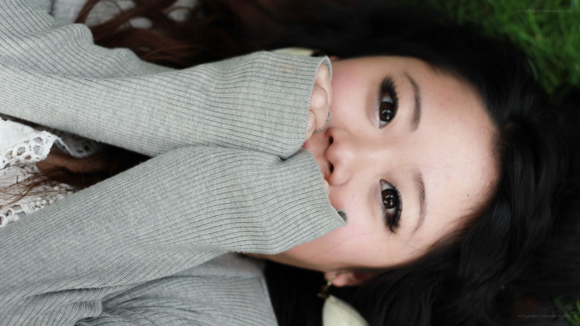woman lying on grass