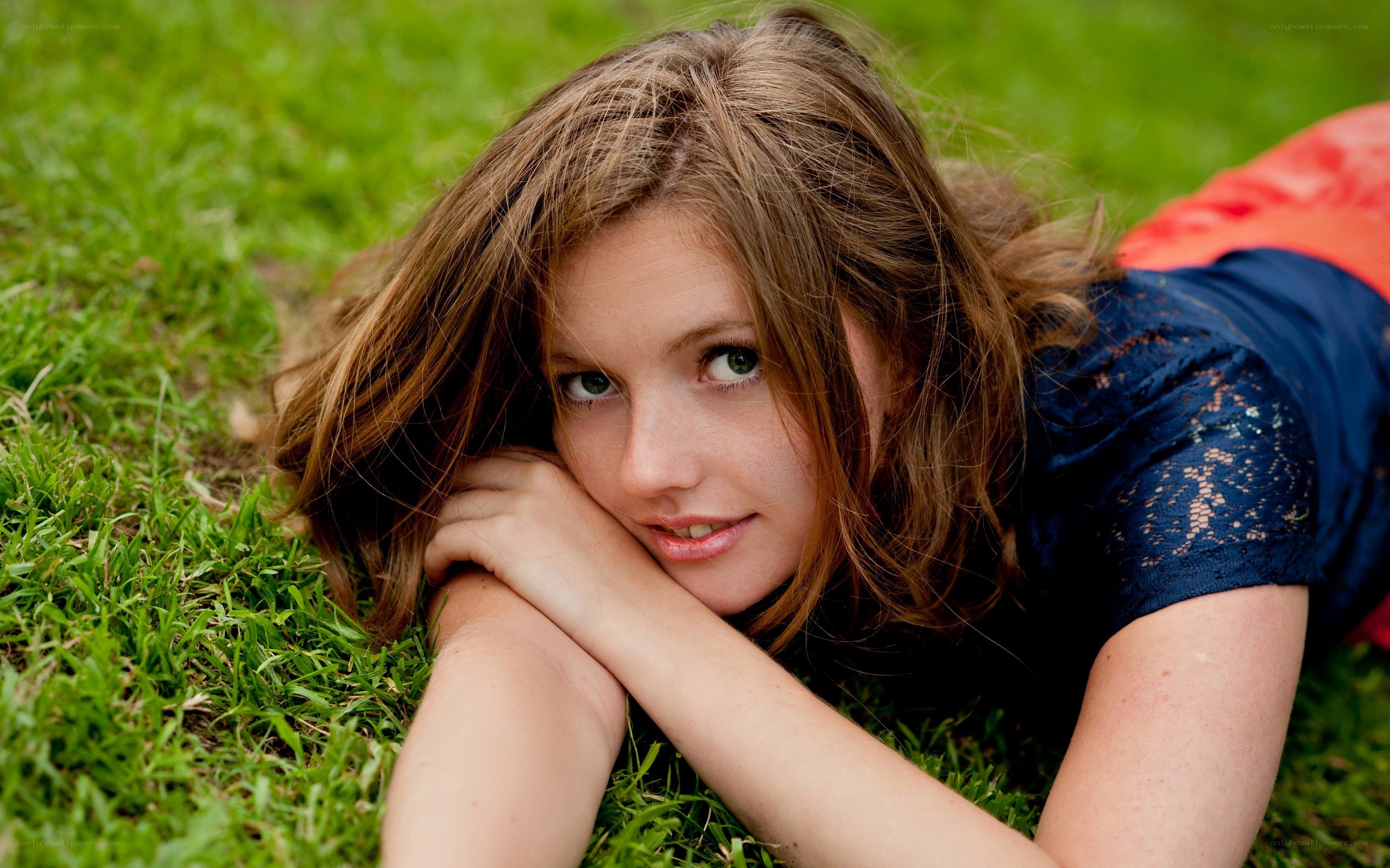 woman lying on grass