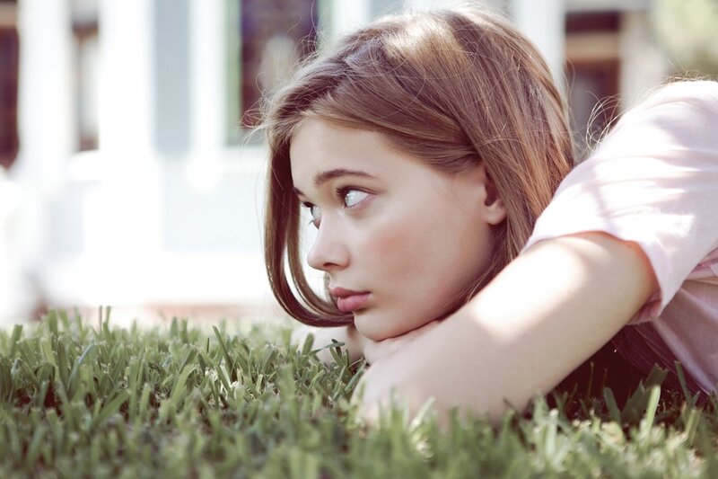 woman lying on grass