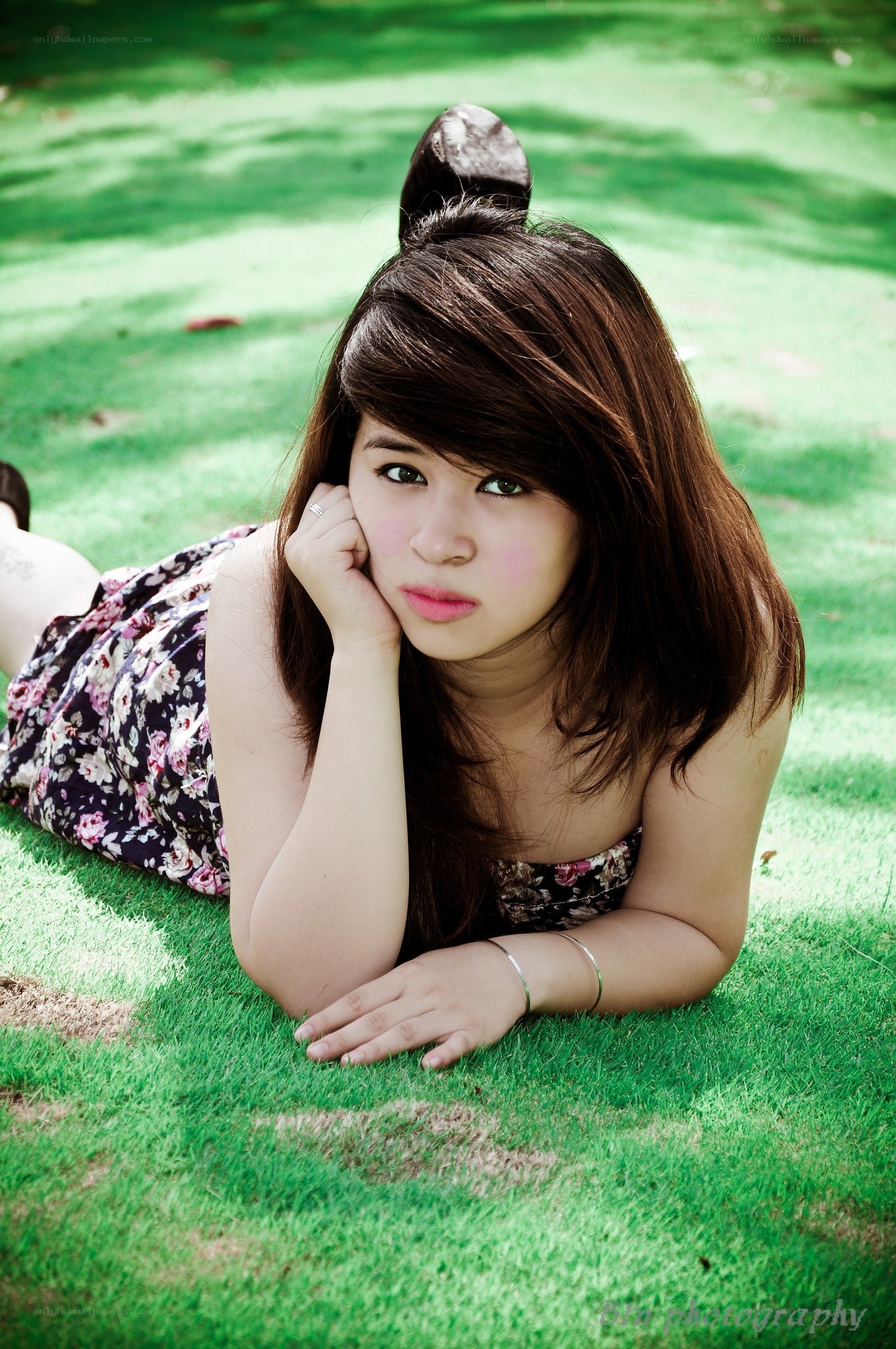 woman lying on grass