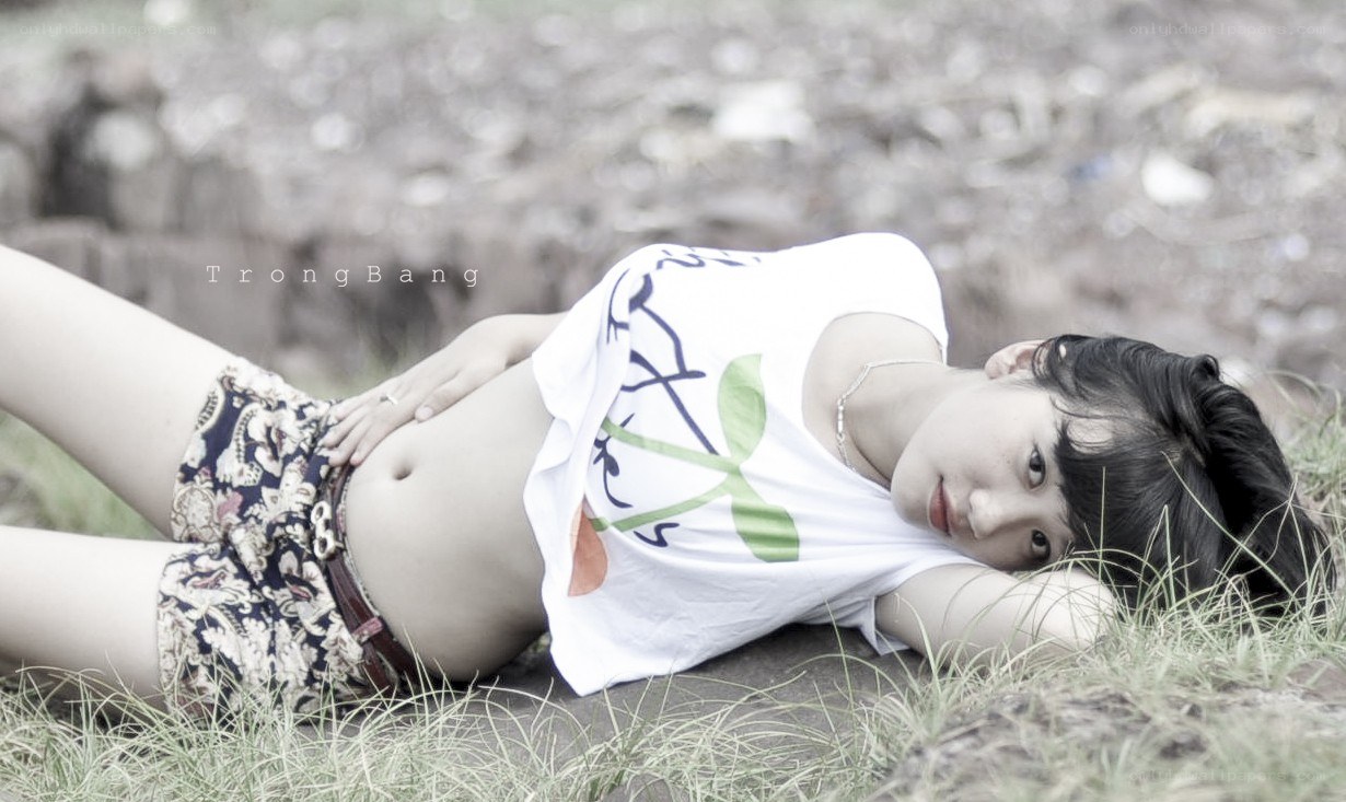 woman lying on grass