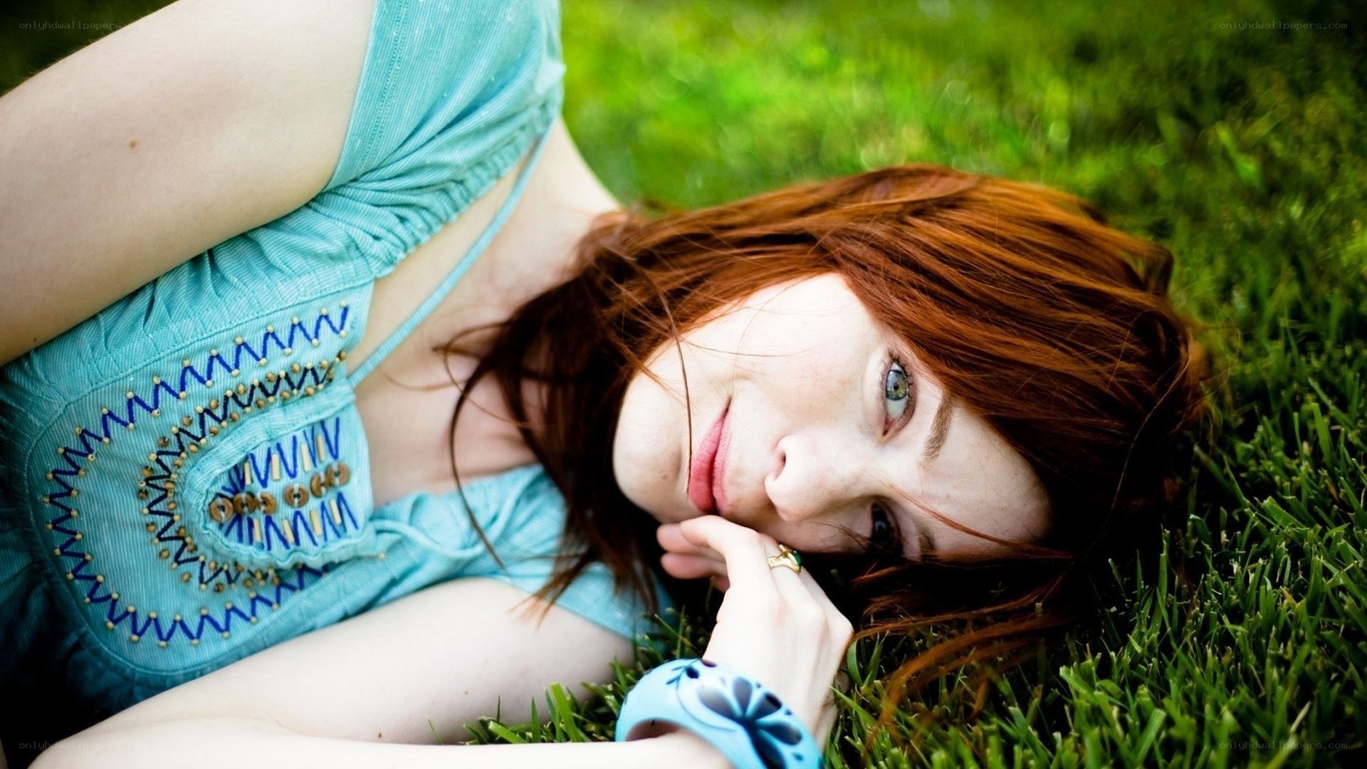 woman lying on grass