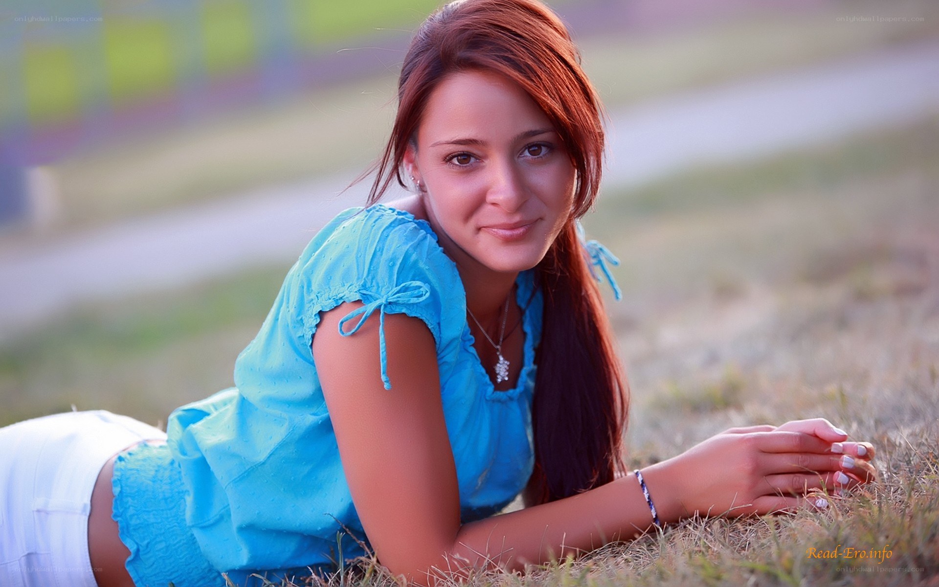 woman lying on grass