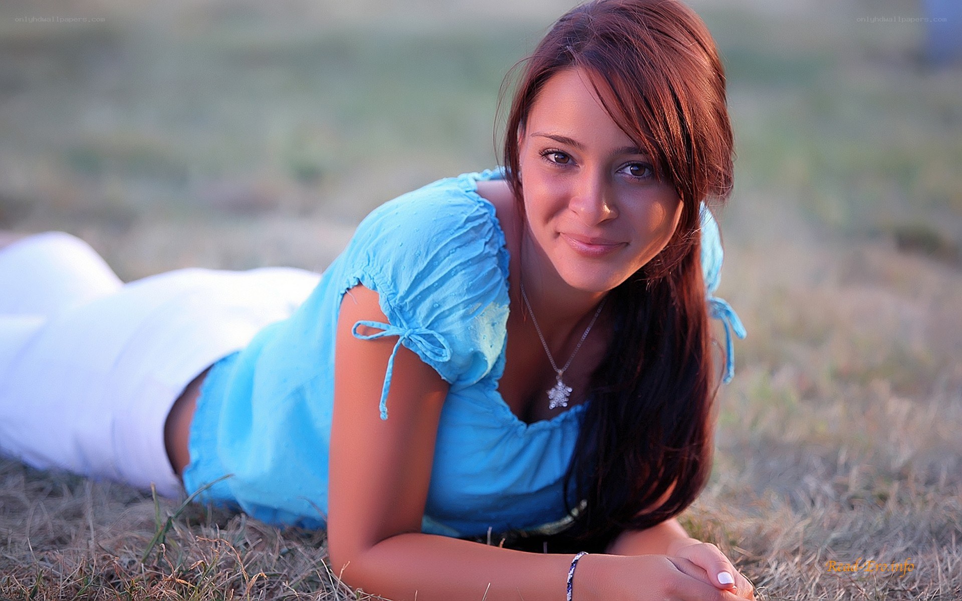 woman lying on grass