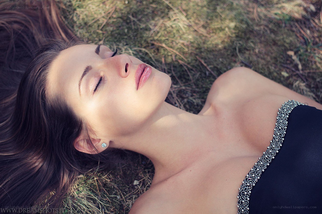 woman lying on grass