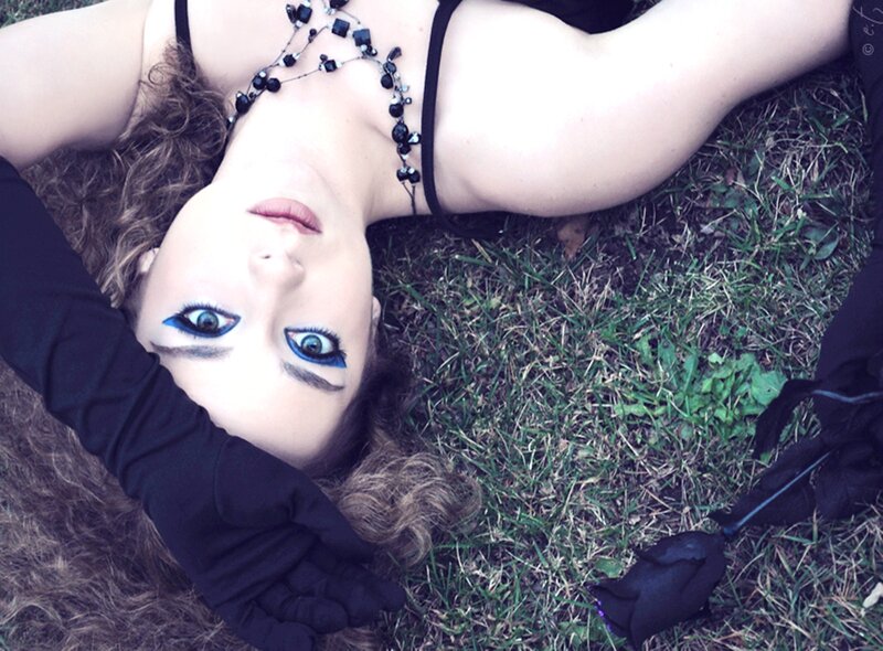 Woman Lying on Grass — Black, Dramatic, Afternoon