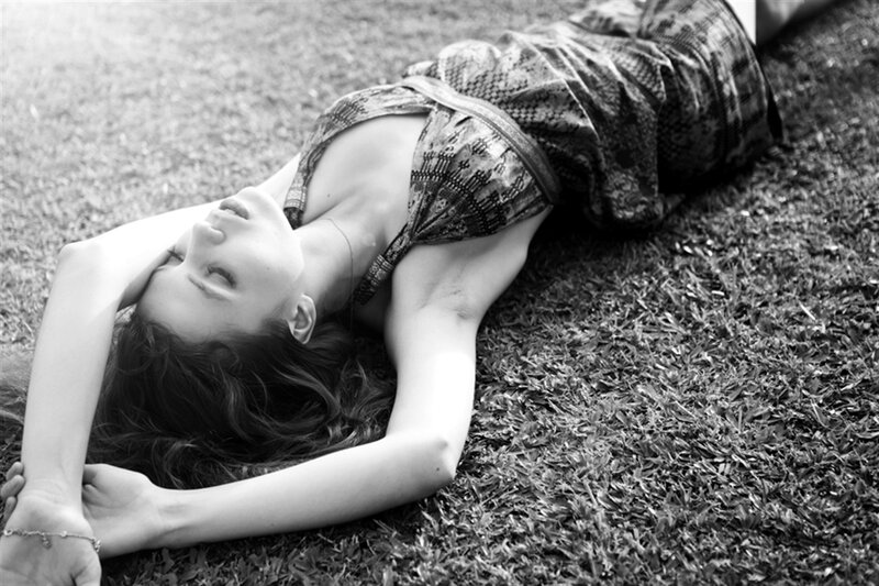 Woman Lying on Grass — Black, Serene, Afternoon