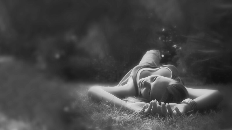 Woman Lying on Grass — Black, Serene