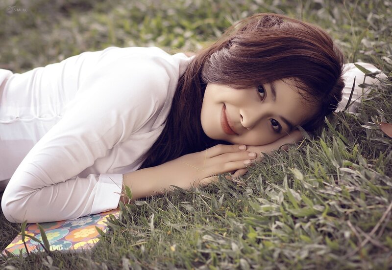 Woman Lying on Grass — Green, Serene, Afternoon, Photograph, Pillow