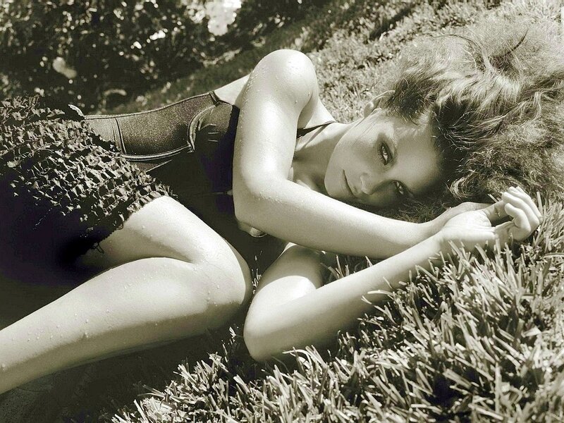 woman lying on grass in swimsuit