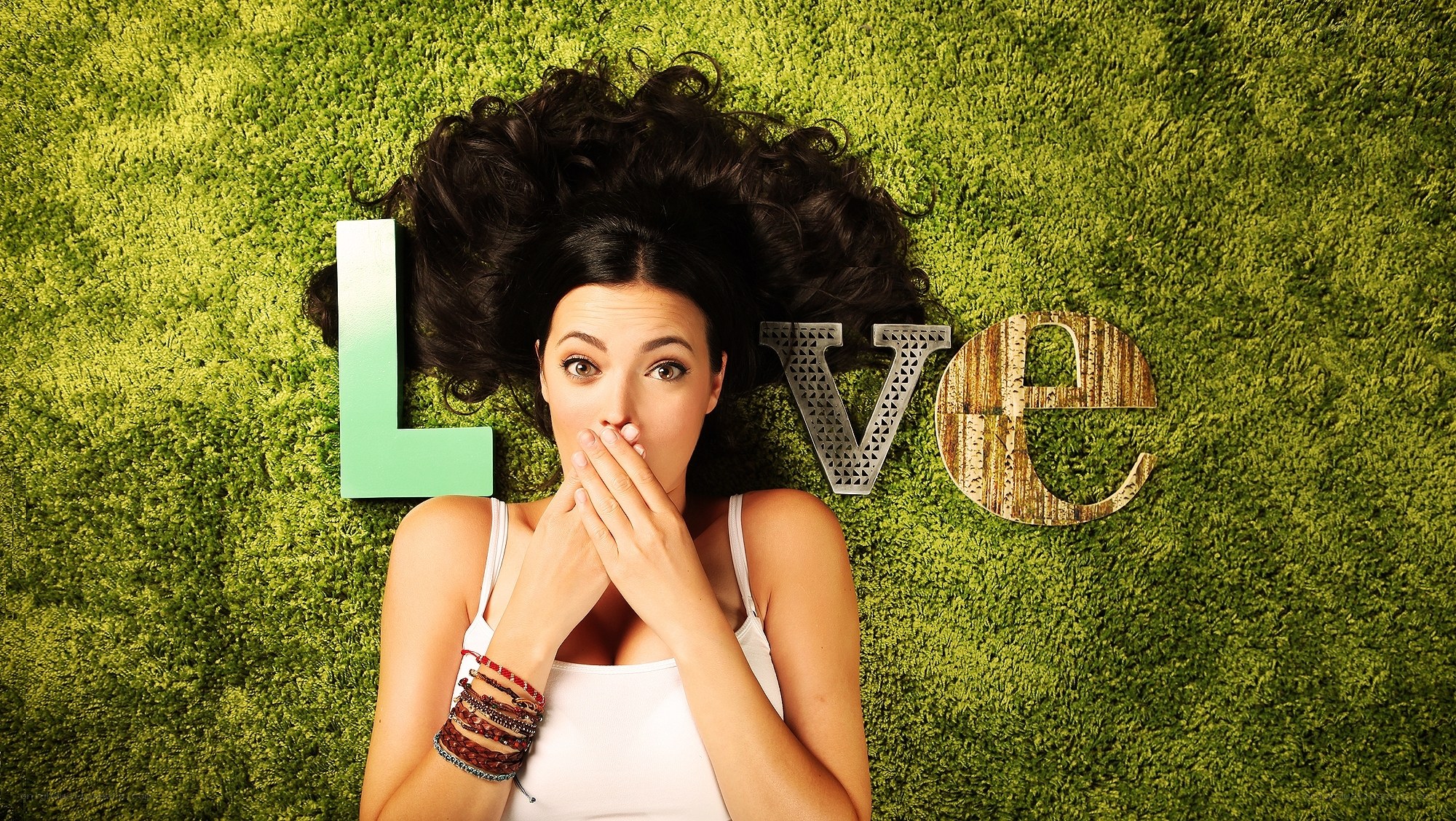 woman lying on grass with love letters