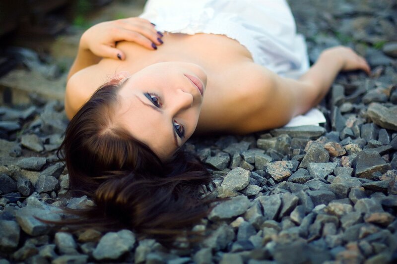 woman lying on gravel