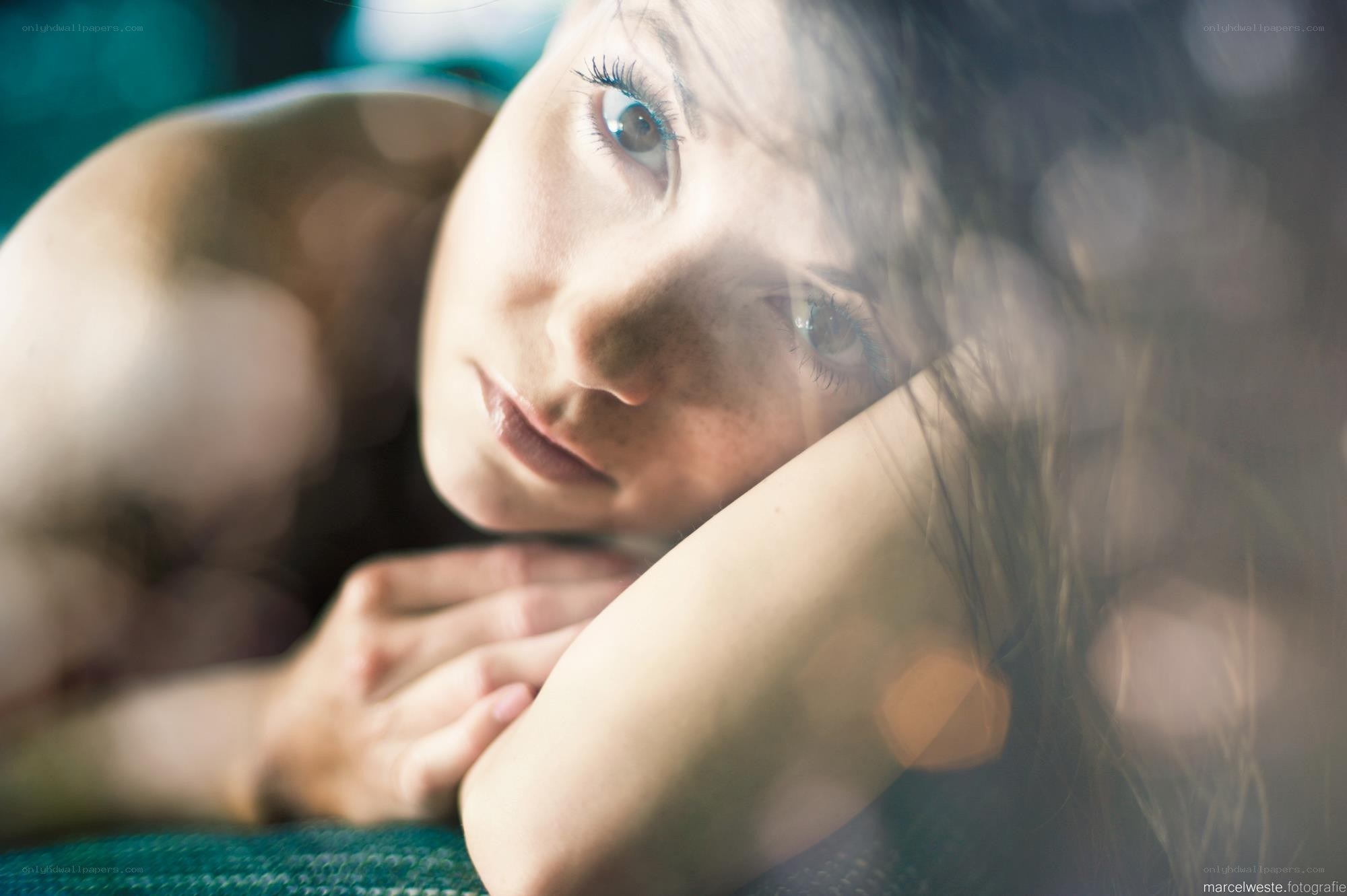 woman lying on green surface