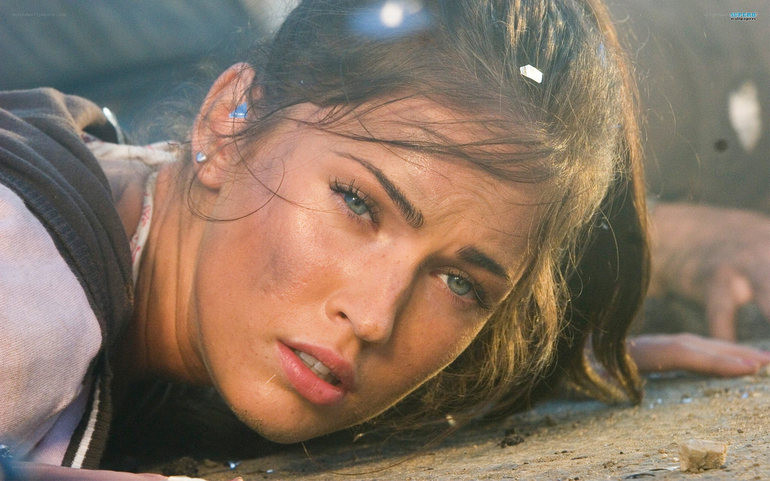 woman lying on ground after explosion